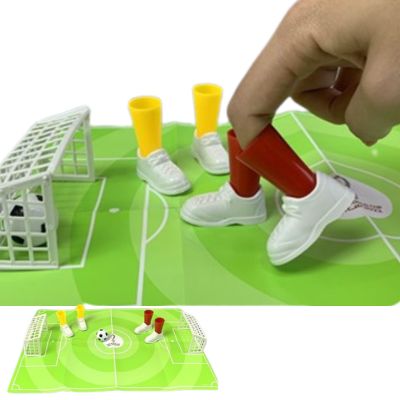 Desktop finger football game set with green field sheet and miniature goal posts
