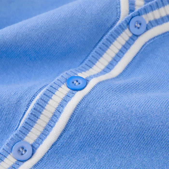 Close-up of af varsity cardigan outfit with buttons and white trim