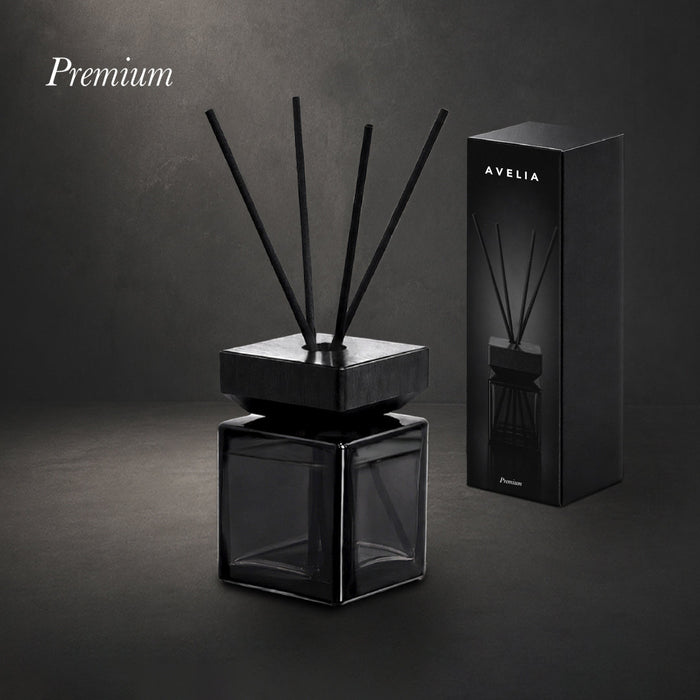 Aromatic diffuser in a gloss black glass bottle with black fibre reeds