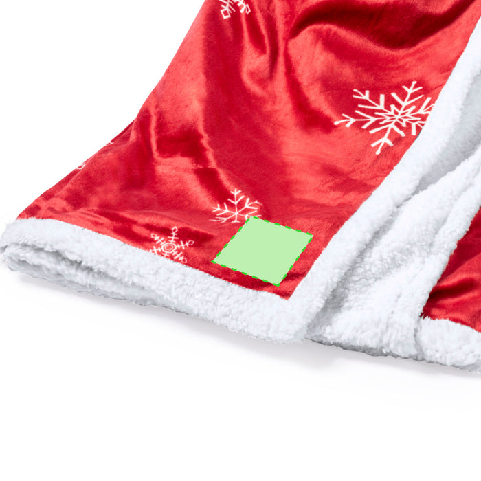 Red snowflake blanket with white sherpa lining and print area marked