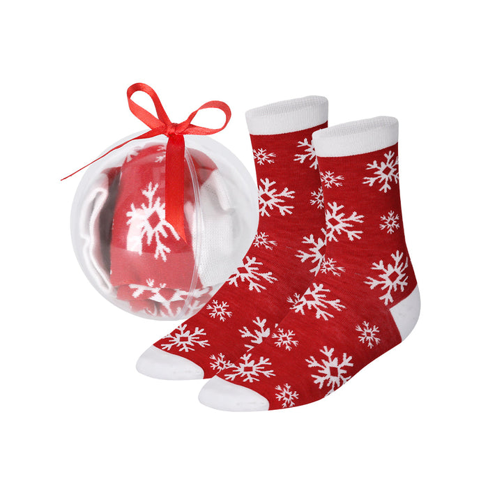 Red and white snowflake Christmas socks shown next to a clear bauble gift pack