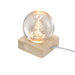 Crystal ball with a lit Christmas tree inside on a wooden base with a cable