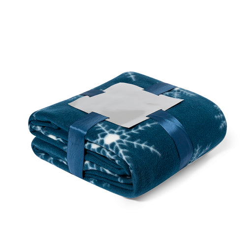Navy snowflake polar fleece blanket folded with a ribbon band and label