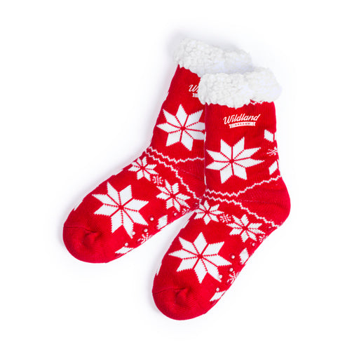 Pair of red snowflake slipper socks with a white lined cuff