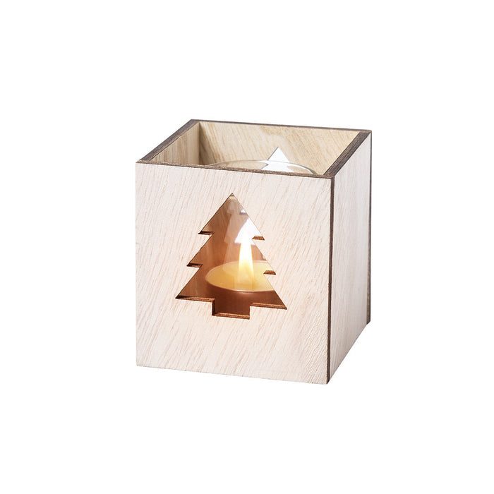 Square wooden tea light holder with a tree cut-out and a lit tea light