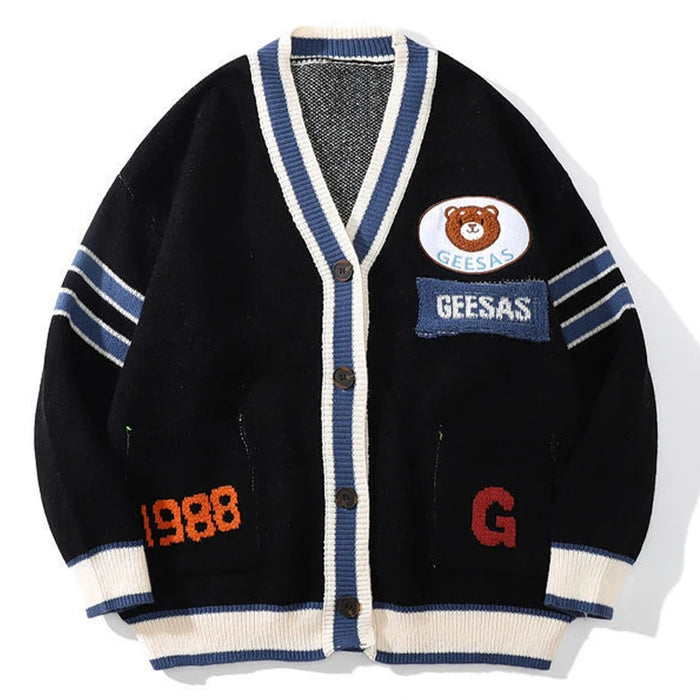 Branded black varsity-style cardigan with white V-neck trim embroidered letter patches