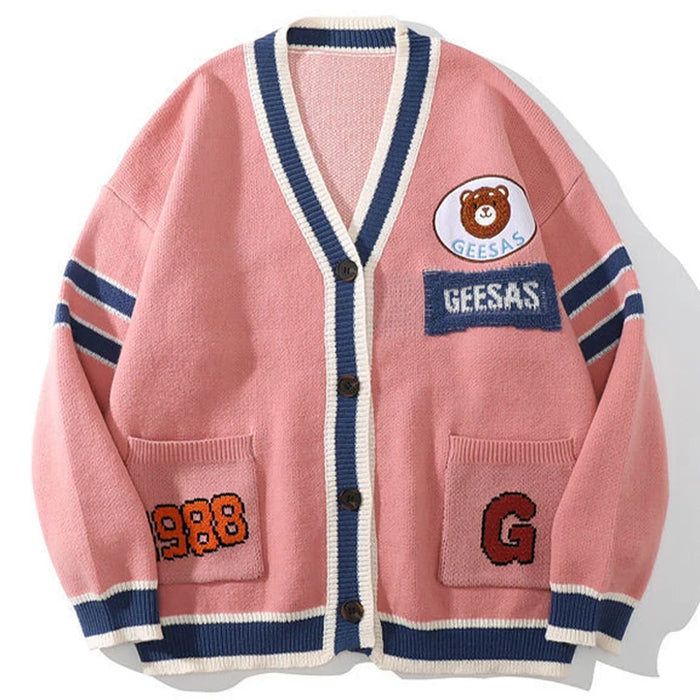 Pink button-front varsity cardigan with navy trim and custom embroidered letter branding