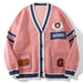Pink button-front varsity cardigan with navy trim and custom embroidered letter branding