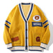Golden yellow jacquard cardigan with logo embroidered branding and navy contrast tipping